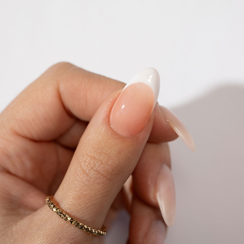 Gelous Peach Builder in a Bottle (BIAB) gel nail polish French tip on model - photographed in Australia