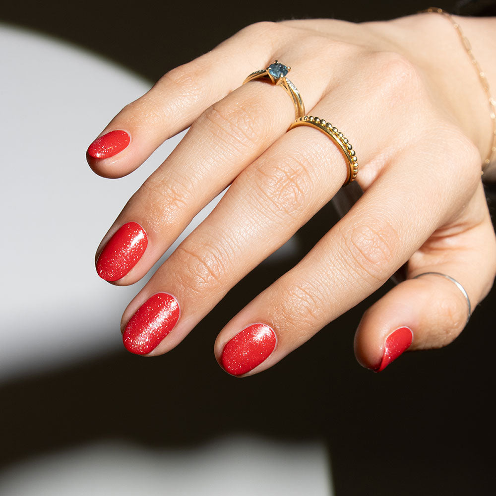 Gelous Shimmer Top Coat on Red Sass gel nail polish - photographed in Australia on model